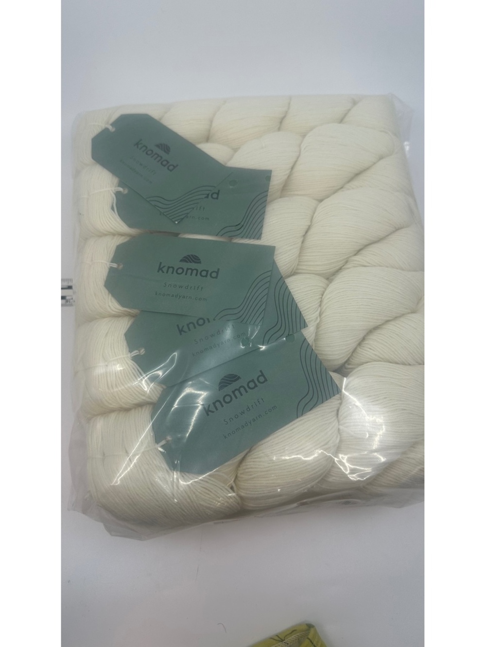 10-pack of Knomad Snowdrift fingering weight yarn